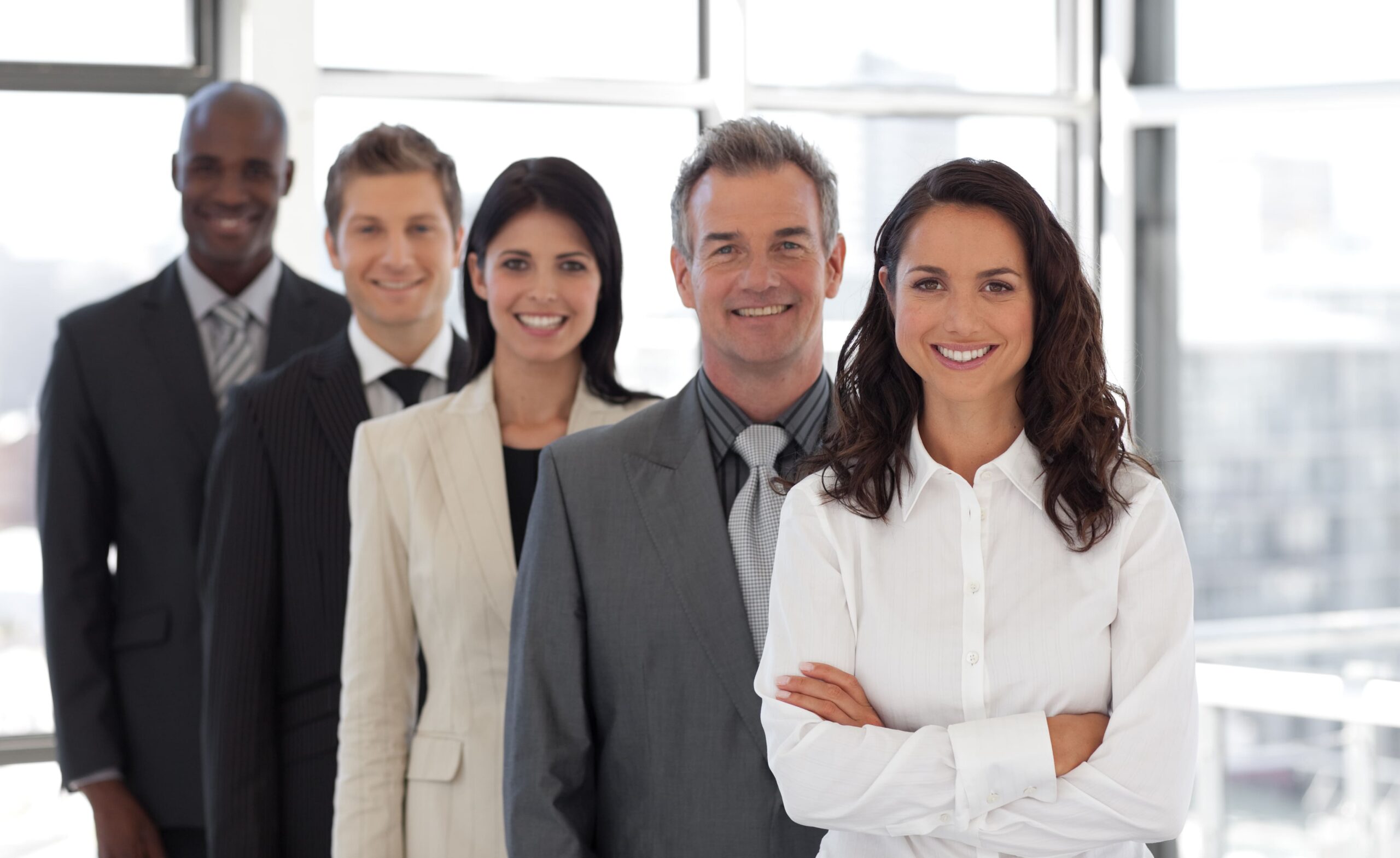 Sales team smiling together